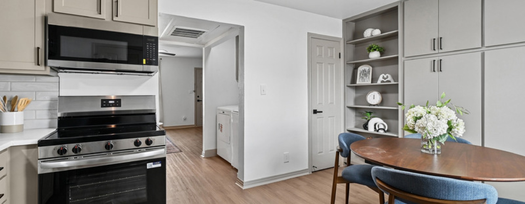 oversized windows brighten spacious, furnished kitchen