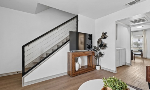entryway with stairs and tv